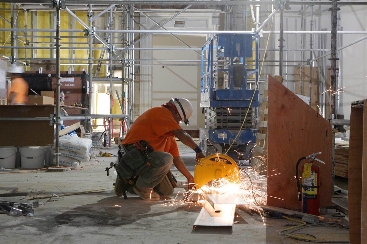 Construction worker welding and sparks are flying