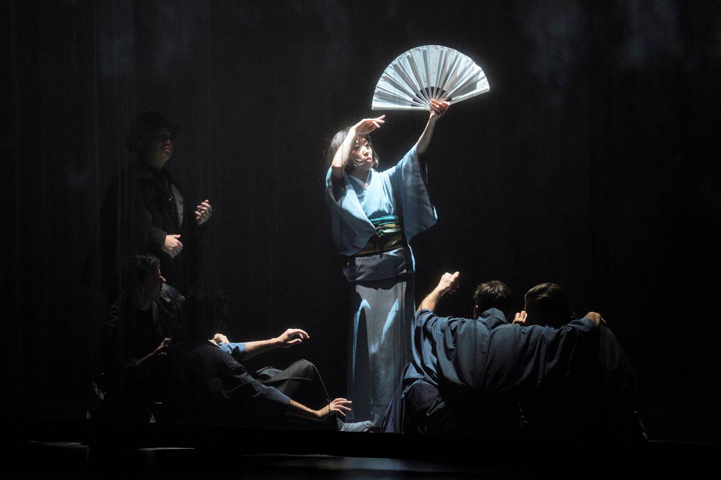 Madame Butterfly in blue dress with a fan