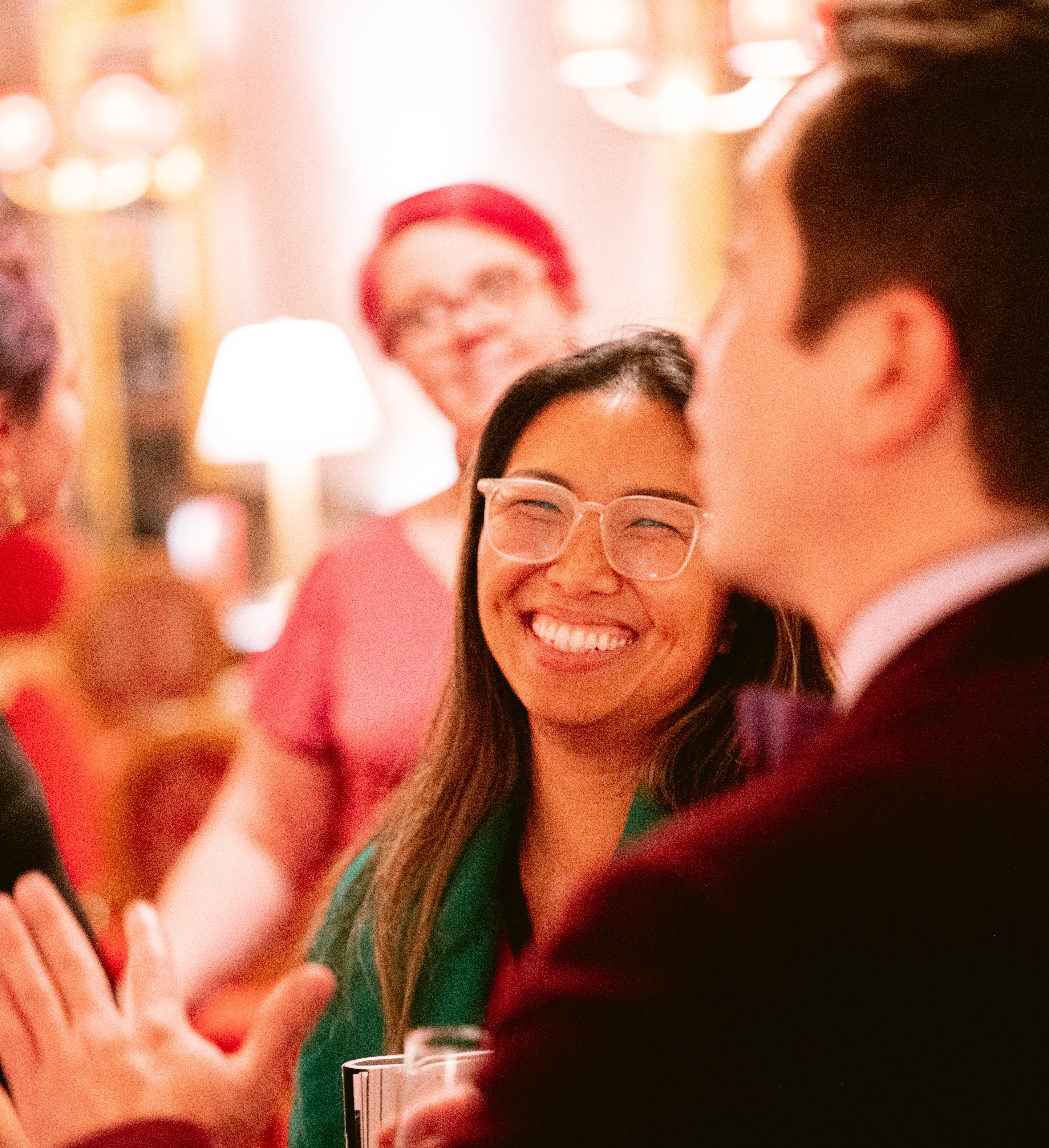 Patrons at Bravo! event smiling and talking