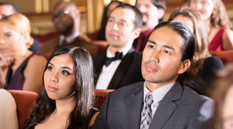 a picture depicting a family at the opera