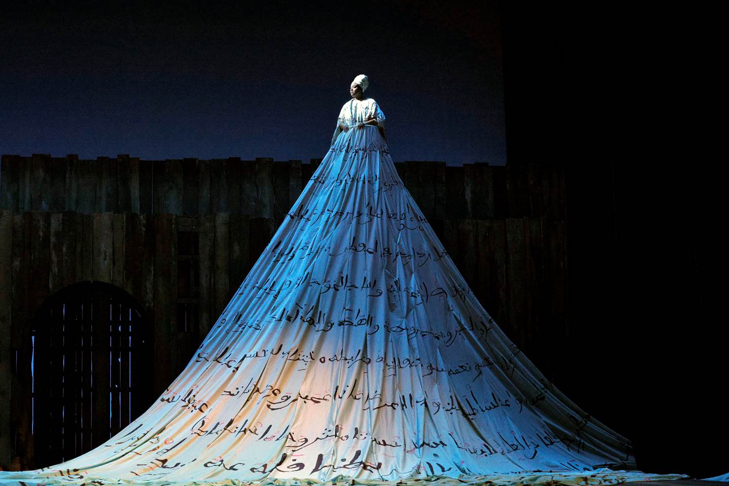 women in long dress elevated on stage