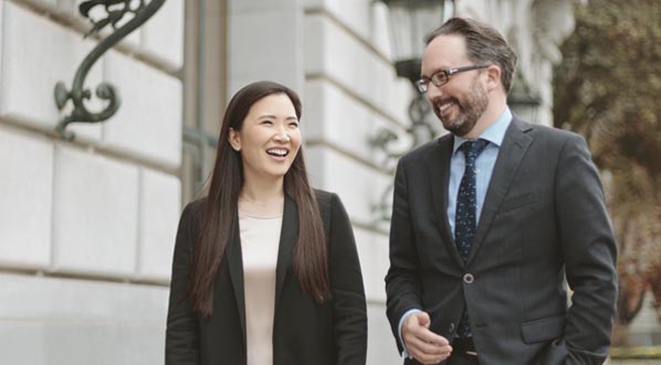 Eun Sun Kim and Director Matthew Shilvock are standing outside of the War Memorial House