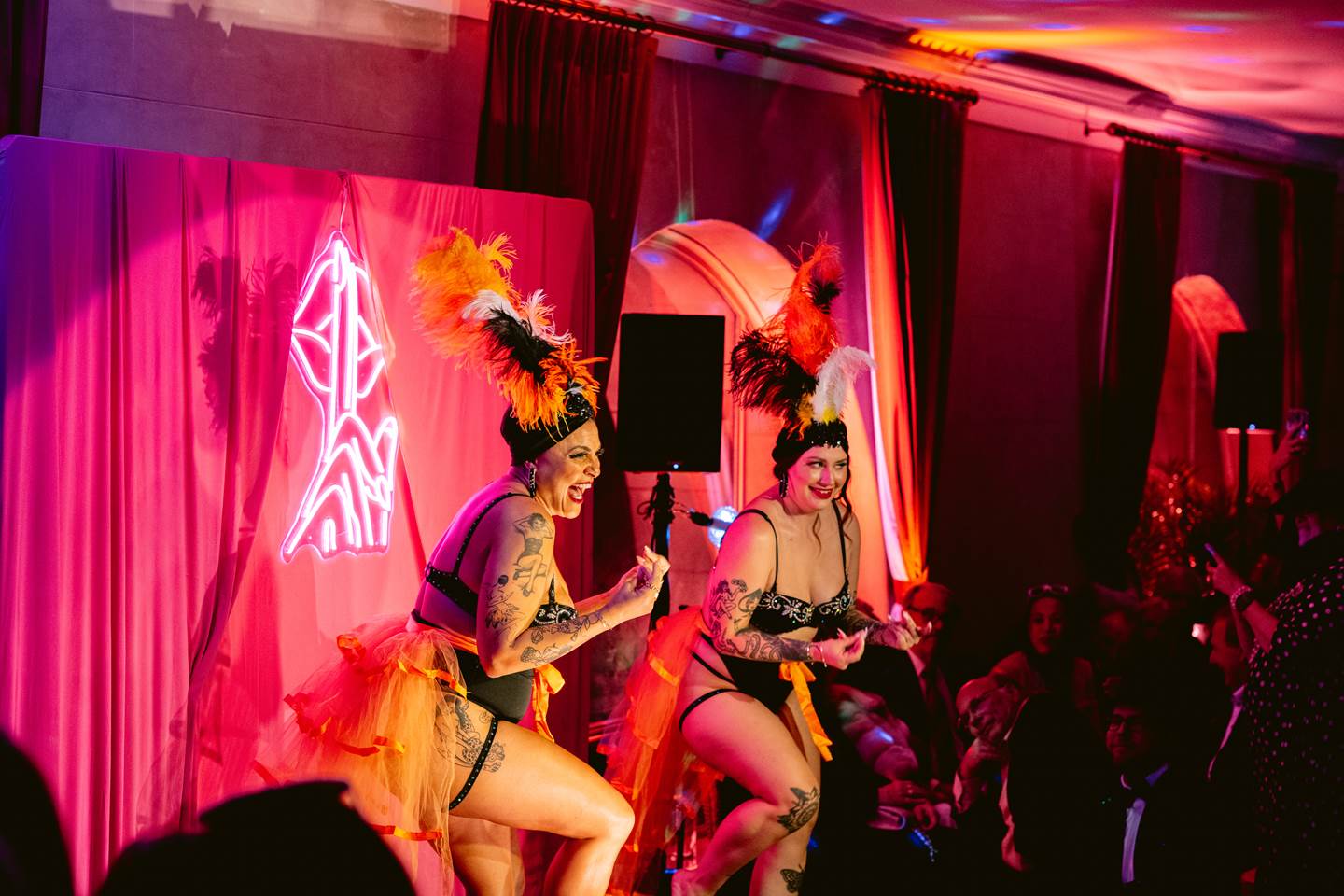 Two cabaret women performing on stage